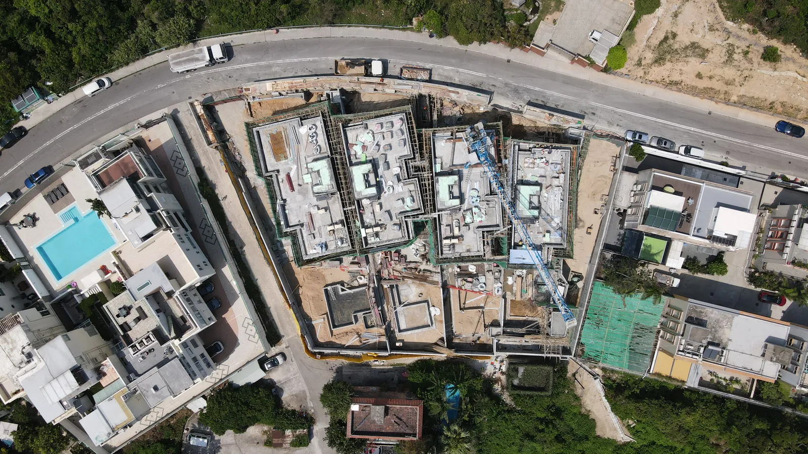 Top-down aerial view of the Villa Panova site with neighbouring homes and roads in Sai Kung.