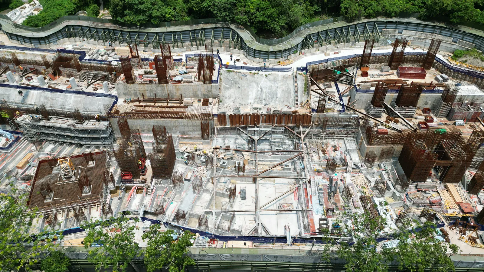 Overhead aerial view of reinforced structures and floor construction zones at the Wang Chau public housing site